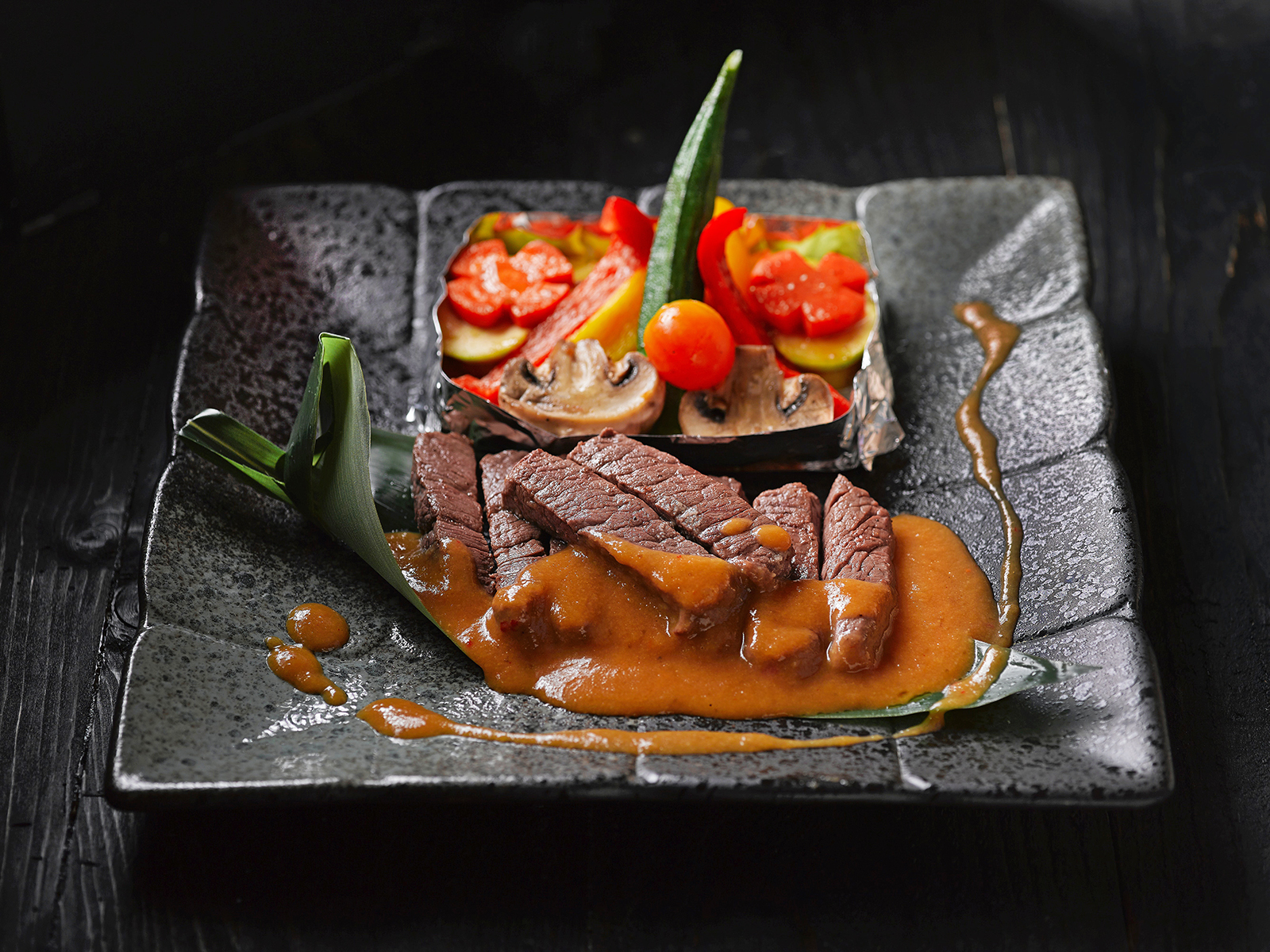 Meat dish with cooked vegetables